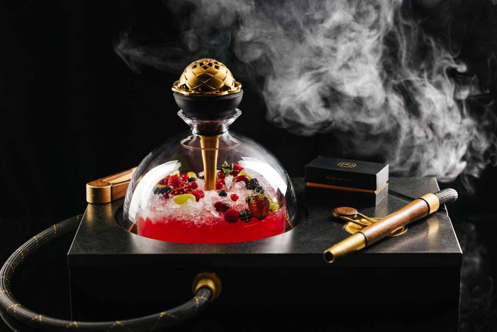 dessert encased in a glass dome with shisha in dubai