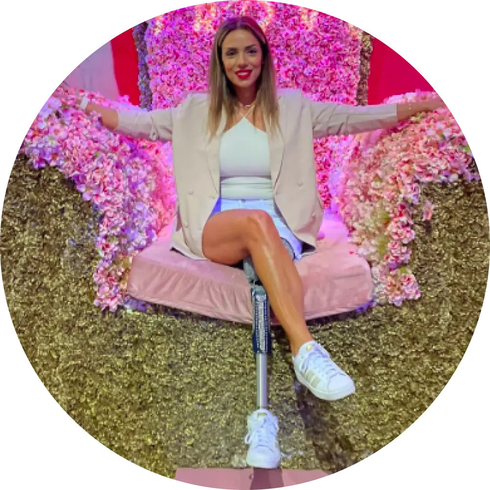 woman in a white outfit with arms stretched out sitting on trove big chair
