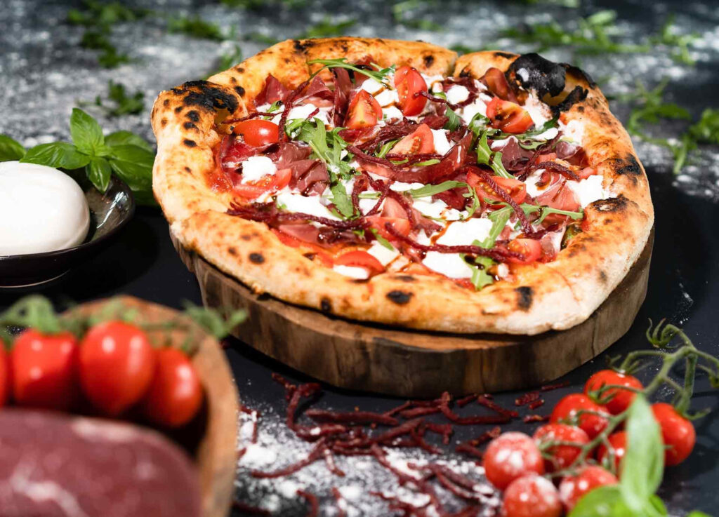 pizza with tomatoes in dubai