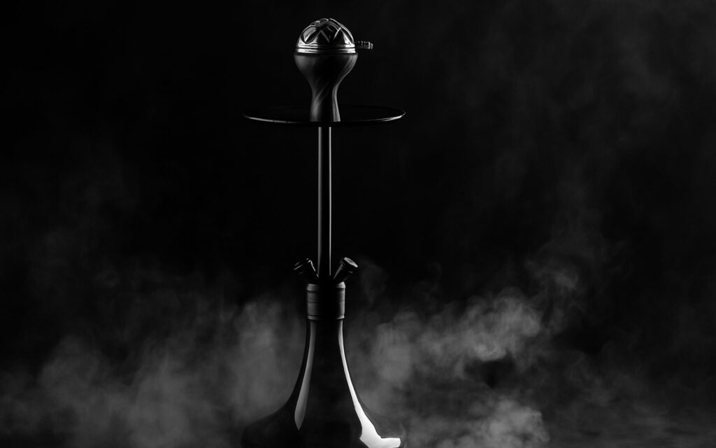 A black shisha with smoke all around