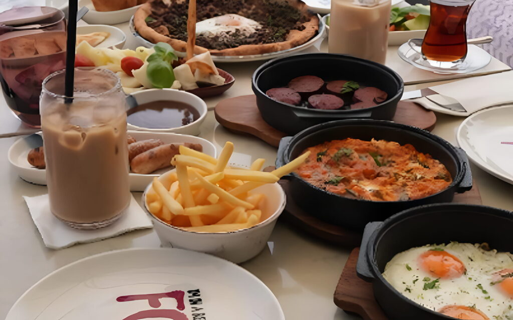Multiple breakfast items on the table with a view