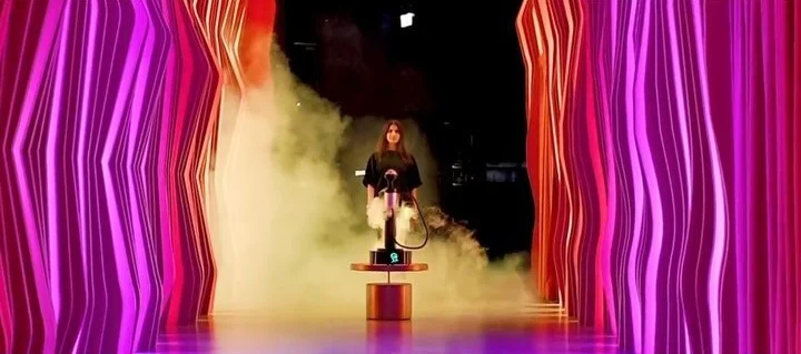 young lady sitting on a chair with premium sisha infront of her