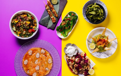 7 dishes on the table with different snacks, garnishes, and sauces