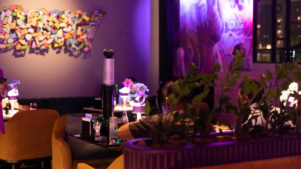 dimly lit restaurant with an shisha on the table in dubai